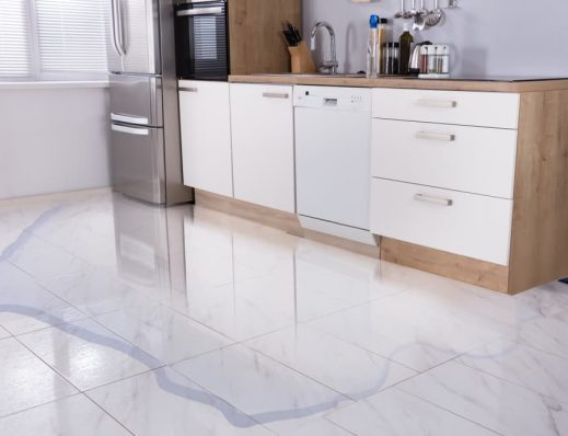 Water leak on kitchen floor — Professional Plumbing Services in Sydney, NSW