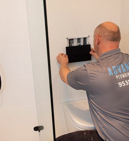 A Plumber Fixing the Bathroom Switch in Sydney, NSW